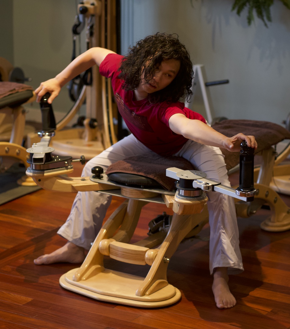 Joseph Liu Gyrotonic Trainer Joseph Liu working the bow and arrow movement on the handles